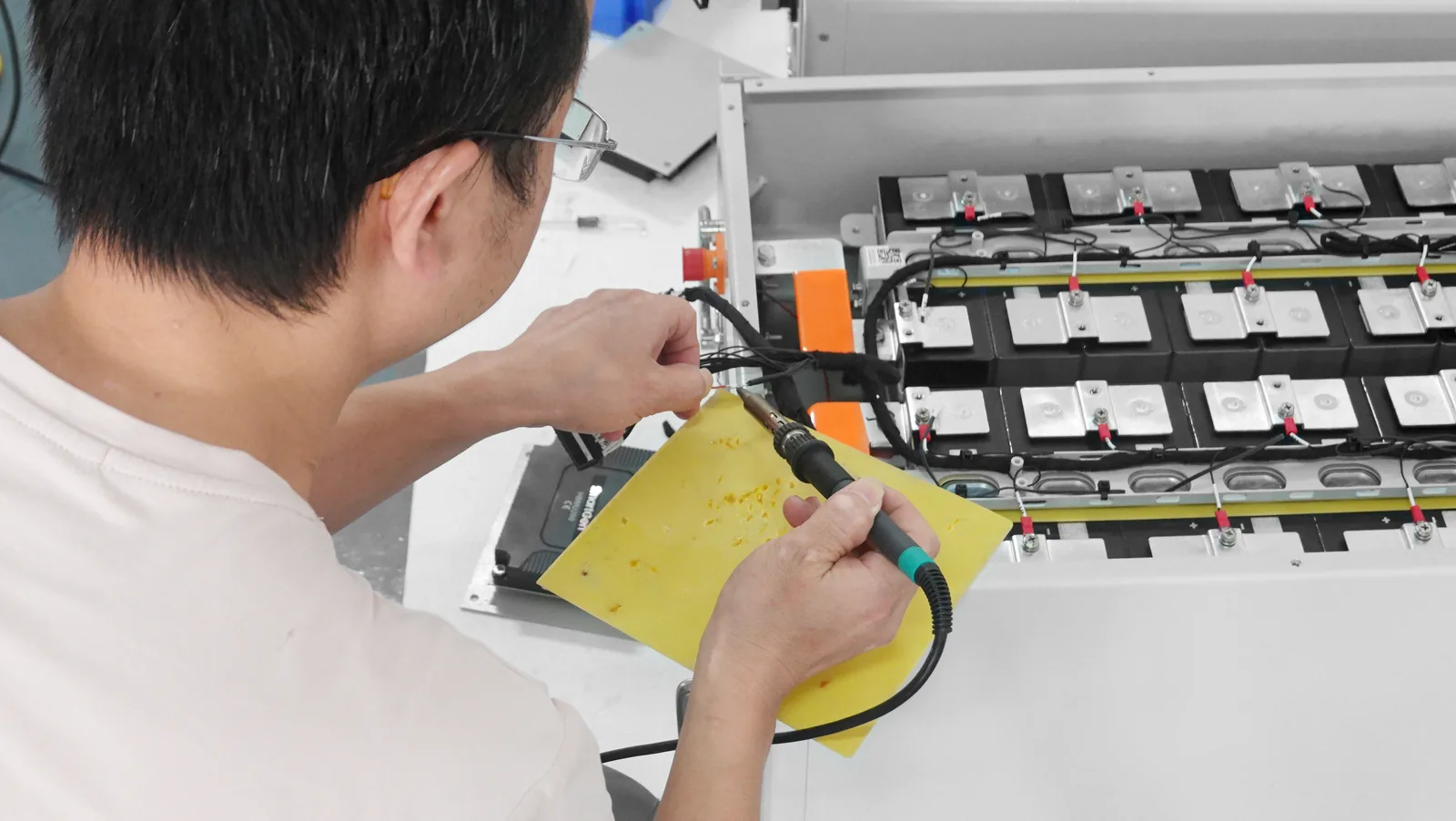 Energy storage product assembly at a manufacturing partner facility
